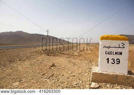 Guelmin 139 Kilometres - Road Sign Distance Indicator On The Road To Guelmin With Blurred Background