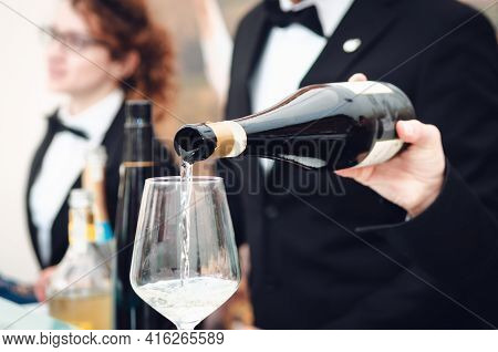 Tasting Experience With A Sommelier Serving A Glass Of Moscato D'asti (muscat) Sparkling Wine In Alb