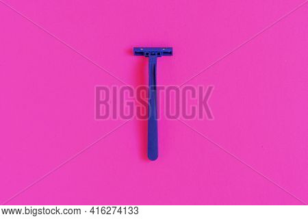 Non-permanent Blue Plastic Shaving Machine Isolated On Pink Background.