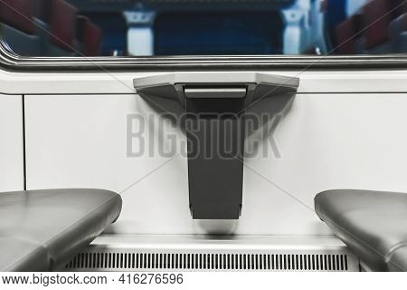 Compact Waste Bin In The Interior Of A Modern Stadler Electric Train.
