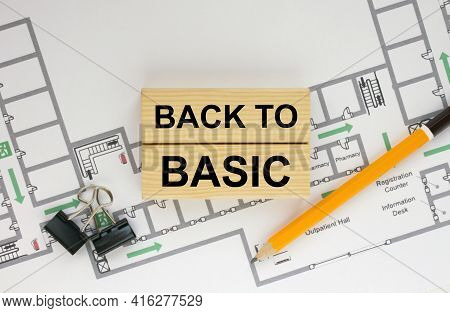 Construction Drawings And Wooden Bars With Text Back To Basic And Paper Clips. Architecture And Buil