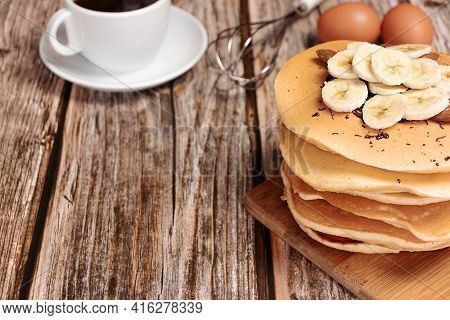 Pancake With Bananas On A Wooden Background, With Place For Text