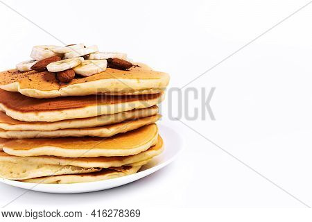Pancake With Bananas On A White Background, Isolated, In A Close-up, With A Place For Text