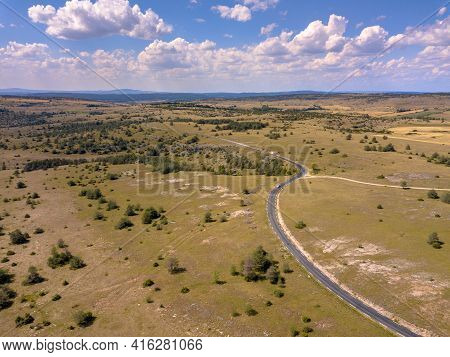 Sealed Winding Road Through Calcareous Limestone Karst Landscape Of Causse Noir In Cevennes France