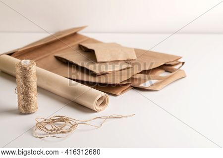 Eco-friendly Packaging Materials. Paper Bag, Cloth Bag, Jute Rope, Cardboard Round Gift Box On A Whi
