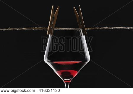Abstract Dry Glass Of Red Wine  On Black Background