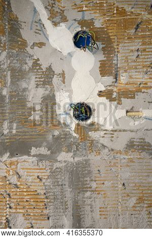 Electrical Wire And Opened Junction Box On Don\'t Plastered Wall. Home Renovation Concept