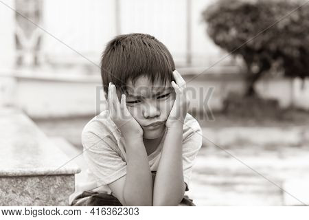 Sepia Tone. 5​-6​ Years​ Old​ Child.​ Alone​ Asian​ Little​ Boy​ Feel​ Sad, Headache And​ Stressed.​