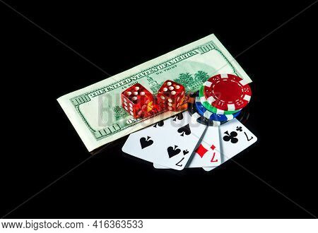 Three Of A Kind Or Set Cards Combination And Dollars With Chips. Winning Combination At A Poker Club