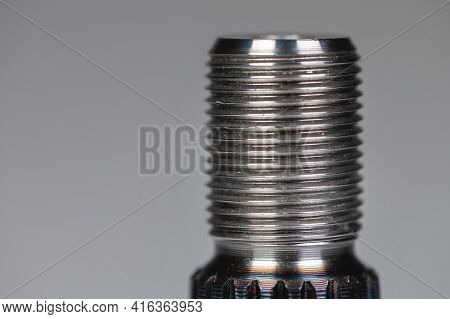 Close-up Thread And Spline Joint Of The Shaft Of The Cv Joint On A Gray Background. Macro Soft Focus