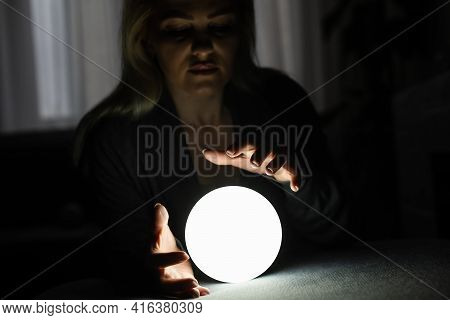 A Fortune Teller Gazes Into Her Ball