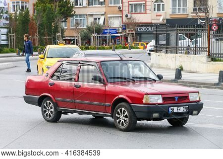Istanbul, Turkey - February 11, 2021: Red Car Tofas Dogan In The City Street.