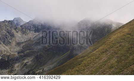 Koscielec From Kasprowy Wierch. Mountain Covered In The Clouds. High Quality Photo
