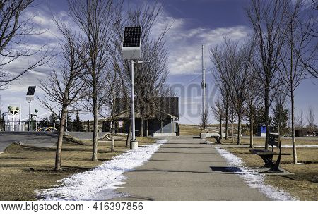 Solar Panels Charging Street Lights At A Sustainable Community Park In Airdrie Alberta Canada.
