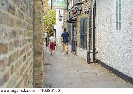 July 2020. London. People Walking Past The Dove Pub, Hammersmith, London England