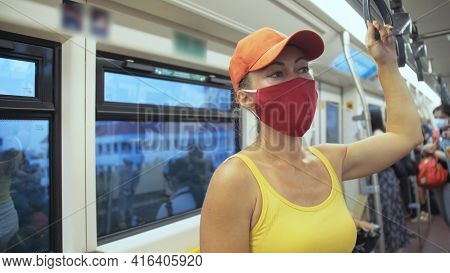 Woman Travel Caucasian Ride At Overground Train Airtrain With Wearing Protective Medical Mask. Girl 