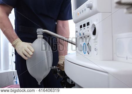 The Anesthesiologist Resuscitator Checks And Connects The Device For Artificial Ventilation Of The L