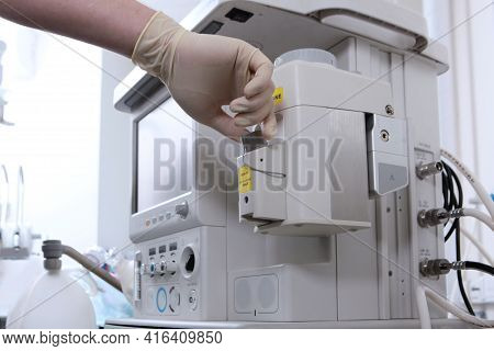 The Anesthesiologist Prepares The Equipment For Surgery Under General Anesthesia. Container For Medi