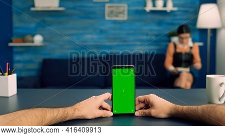 Point Of View Freelencer Man In Office Studio Holding Mock Up Green Screen Chroma Key Phone