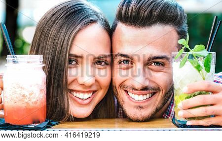 Handsome Man And Young Woman Smiling On Happy Hour At Cocktail Bar - Young Lovers Couple At Beginnin