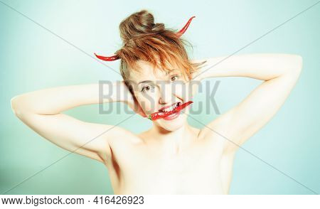 Funny Girl Portrait As A Devil With The Red Chili Peppers Horns, Holding Another Pod Of Pepper In Th