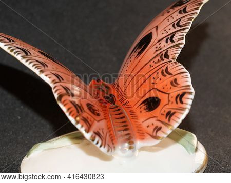 Porcelain Butterfly Figurine Isolated On Black Background