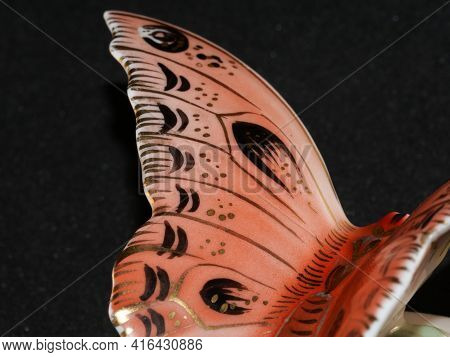 Porcelain Butterfly Figurine Isolated On Black Background