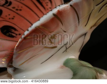 Porcelain Butterfly Figurine Isolated On Black Background