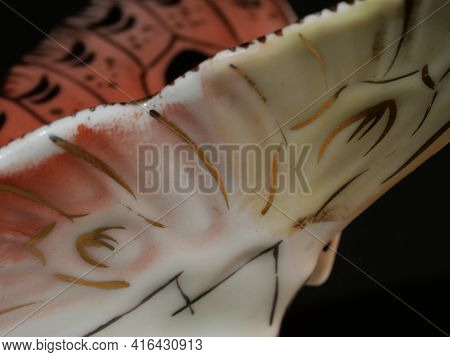 Porcelain Butterfly Figurine Isolated On Black Background