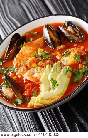 Sopa De Mariscos Seafood Soup Closeup In The Plate On The Table. Vertical