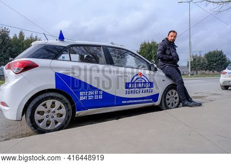 Kemerburgaz, Istanbul, Turkey - 03.19.2021: One Young Male Instructor Of Driving Test Car In Turkey 