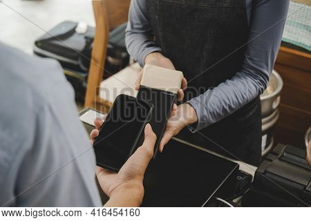 Young Customer Using Digital Mobile Phone Scan Bar Code Pay For Buying Coffee In Modern Cafe Coffee 