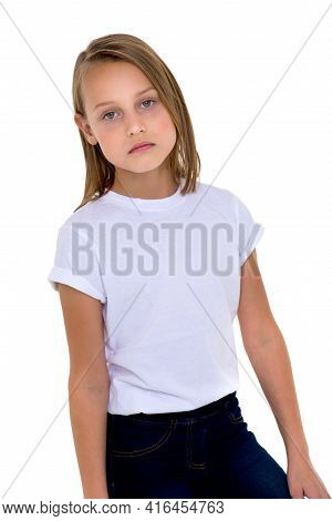 Blonde In A White T-shirt In The Studio On A White Background. Close-up