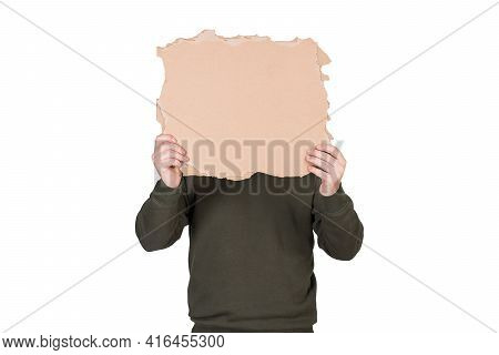 Anonymous Man Covers His Head With A Blank Cardboard Sheet, Copy Space For Messages. Empty Banner Fo