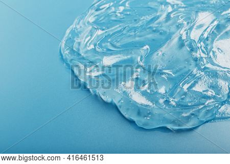Antiseptic Gel On A Blue Background In Waves.
