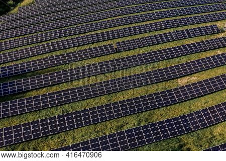 Solar Panels In Aerial View. Power Farm Producing Clean Energy.