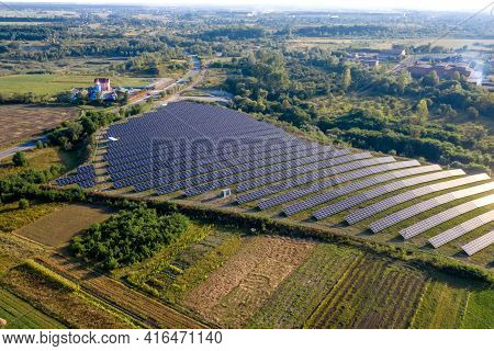 Solar Panels In Aerial View. Power Farm Producing Clean Energy.