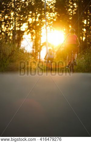 Happy couple riding bicycles outside, healthy lifestyle fun concept, taking a break admiring the view