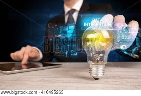 Businessman holding a light bulb, online security concept