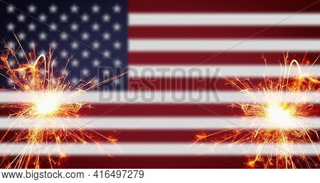 Vintage Celebration With Sparklers And Defocused American Flag - 4th Of July.