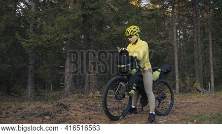 The Woman Travel On Mixed Terrain Cycle Touring With Bike Bikepacking. The Traveler Journey With Bic