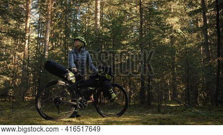 The Woman Travel On Mixed Terrain Cycle Touring With Bike Bikepacking. The Traveler Journey With Bic