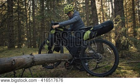 The Woman Travel On Mixed Terrain Cycle Touring With Bike Bikepacking. The Traveler Journey With Bic