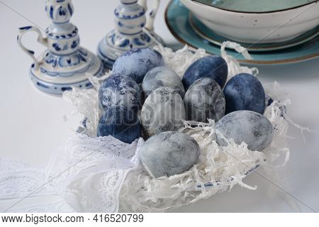 Easter Table Setting.  Decorated Easter Eggs  In An Easter Basket