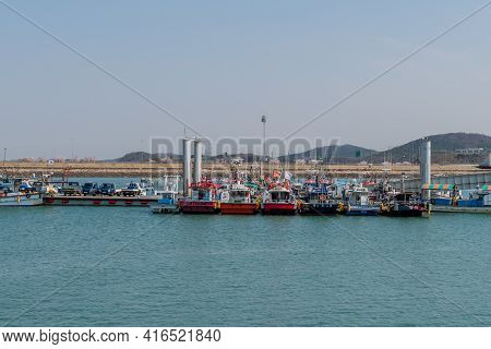 Pyeongtaek, South Korea; April 6, 2021: Fishing Boats Moored To Floating Dock At Jeongok Port.