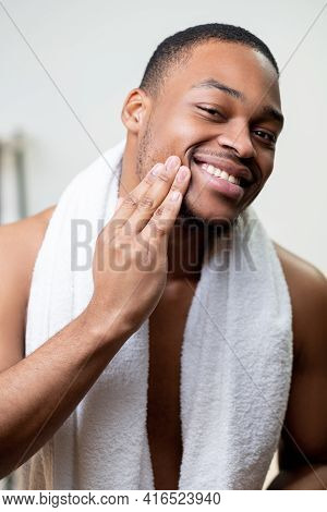 Beard Care. Facial Treatment. Male Grooming. Happy Satisfied Shirtless African Man With White Towel 