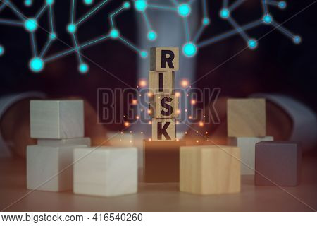 Wooden Blocks With Teh Word Risk With Fantasy Background.
Executive And Risk Control Concept And The