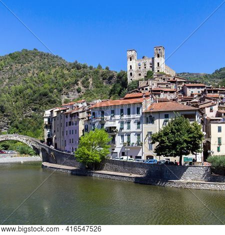 Dolceacqua Town. Liguria, Italy The Monet's Bridge On The River Nervia. On The Hill Is Located The D
