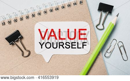 Text Value Yourself On A White Sticker With Office Stationery Background. Flat Lay On Business, Fina