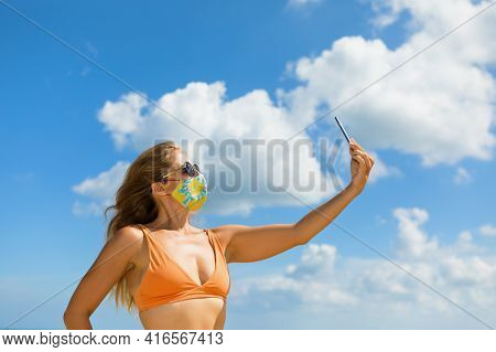 Funny Girl Taking Selfie Photo By Smartphone On Tropical Sea Beach. New Rules To Wear Cloth Face Cov